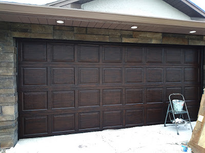 paint a garage door to look like really dark wood