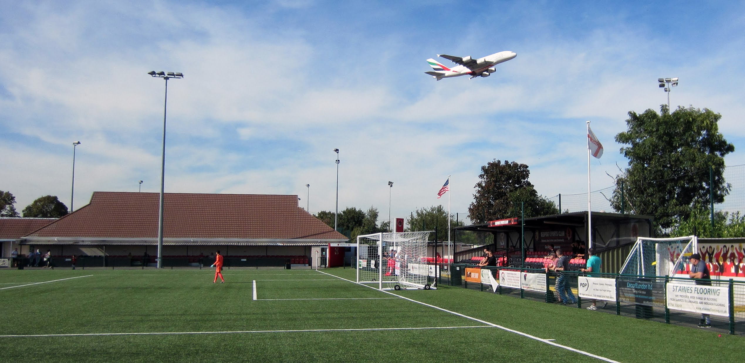 A British Airways flight takes off over Bedfont Sports Recreation Ground