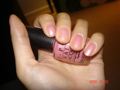 pink nail polish bottle. glittery pink nail polish.