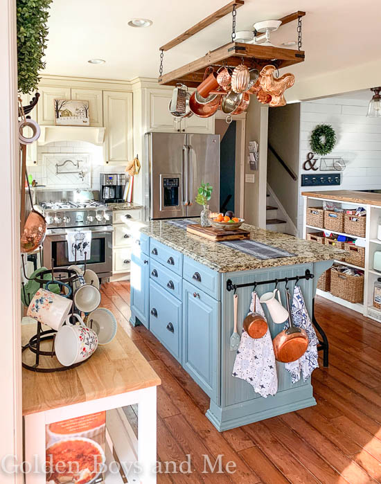 Farmhouse style kitchen with painted kitchen island with Oval Room Blue paint - www.goldenboysandme.com