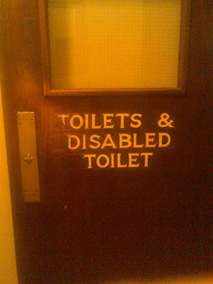 An internal door, signed toilets and disabled toilet