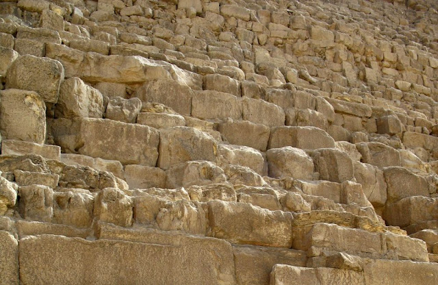 boulders at the bottom of the pyramids