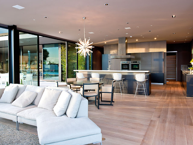 Photo of modern kitchen as seen from the living room of modern luxury Hollywood house