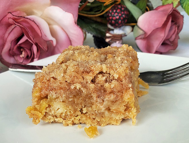 apple cake with streusel topping  on a plate