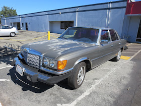 1979 Mercedes S-Class with old, faded, peeling paint.