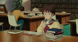 animated young Japanese student studying in the library