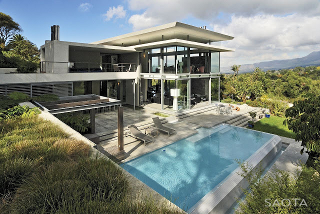 Picture of modern villa with the pool as seen from the hill right next to the house