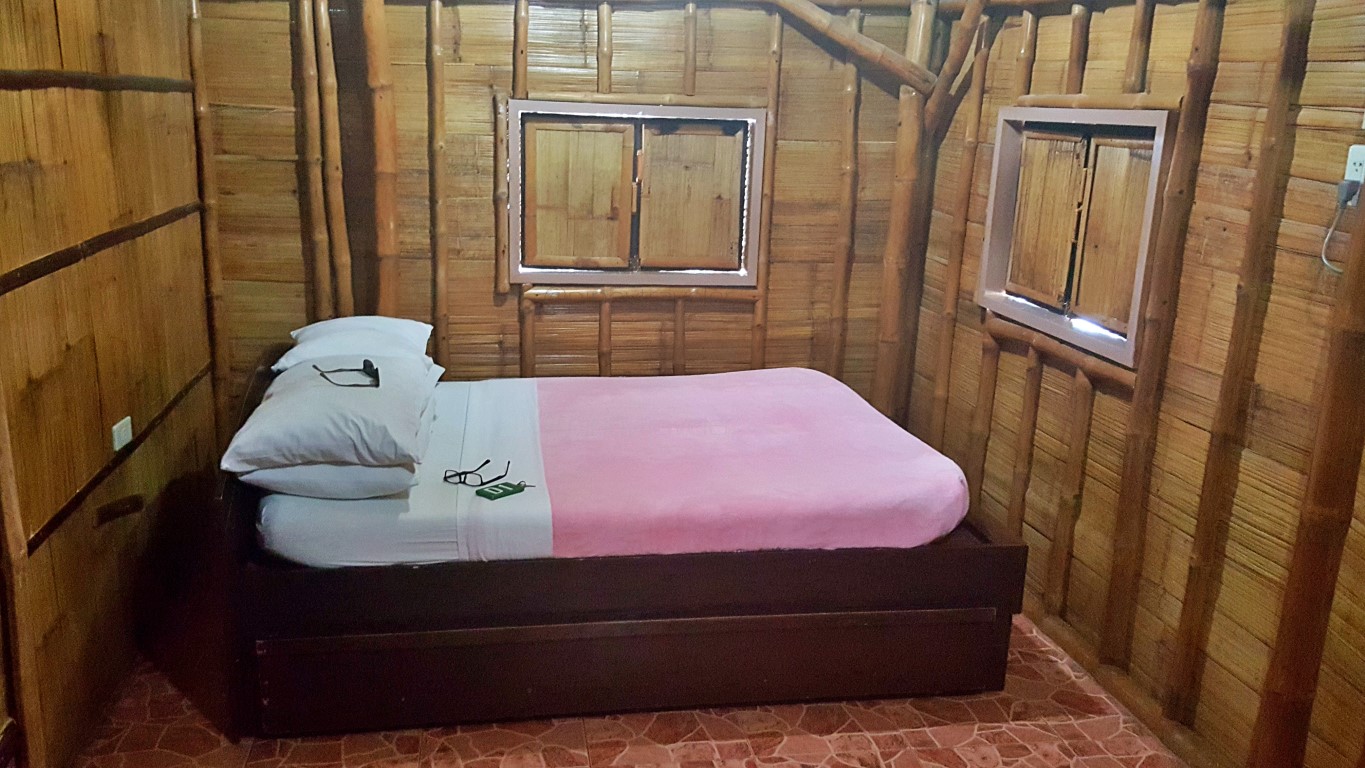 bedroom of Cottage D1 at Isla Jardin Del Mar Resort in Glan, Sarangani