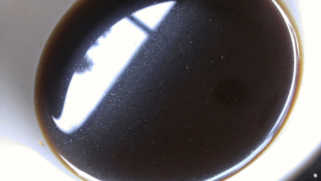 close up of oils in coffee