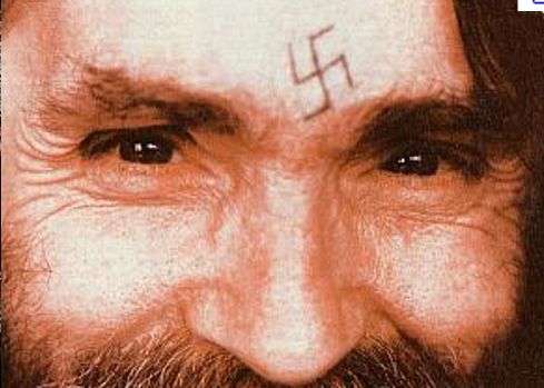 Charles Manson has two unknown tattoo designs, one on each forearm, 