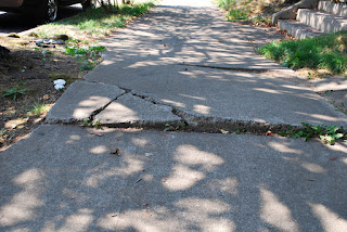 Sidewalk with cracks and bumps