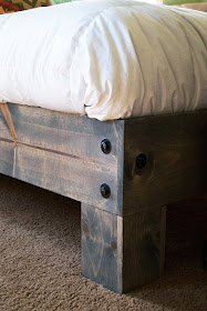 close up of platform bed leg with bolts