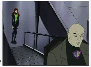 Charles Xavier rolling up a ramp, not looking at Jean who is standing at the base of it.