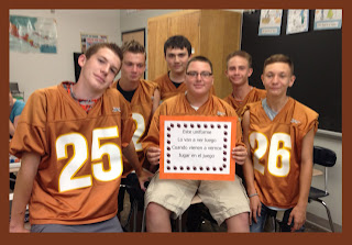 The football players from Lonnie Dai Zovi's Spanish 1 class are holding the "unifome" chant (a new member of the popular Spanish Snappy Sayings) said when they wear their sports uniform.