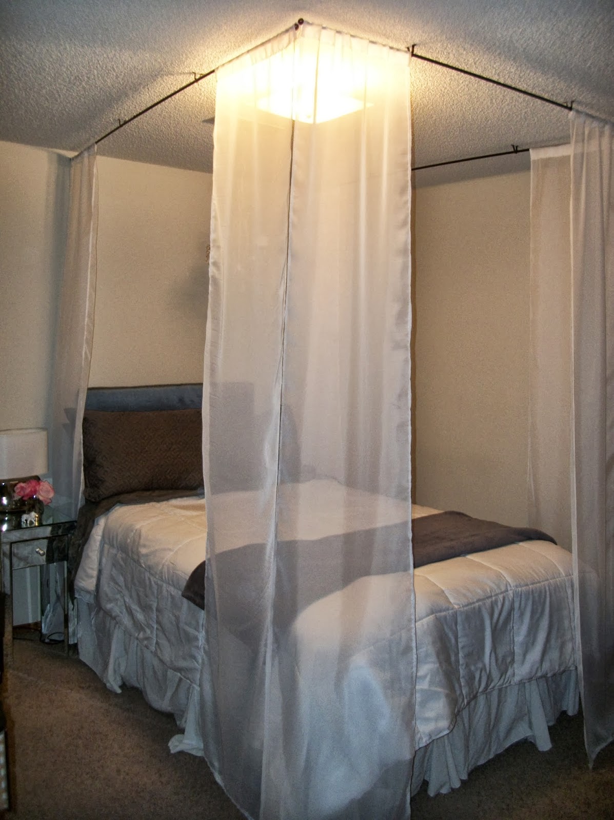 Fifth - Hang your curtains and enjoy your beautiful faux canopy bed.