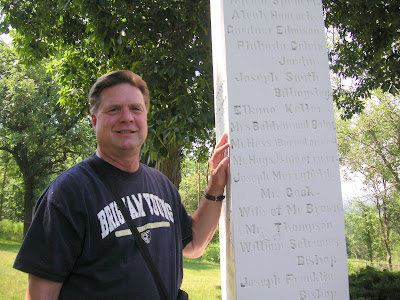 Descendent Roland Lee stands by Mt. Pisgah Monument where Jacob Hess died