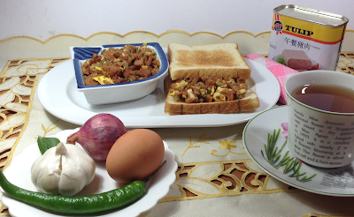 Stir-fried luncheon meat, sandwich, can of luncheon meat, a cup of tea, garlic, green chili and egg
