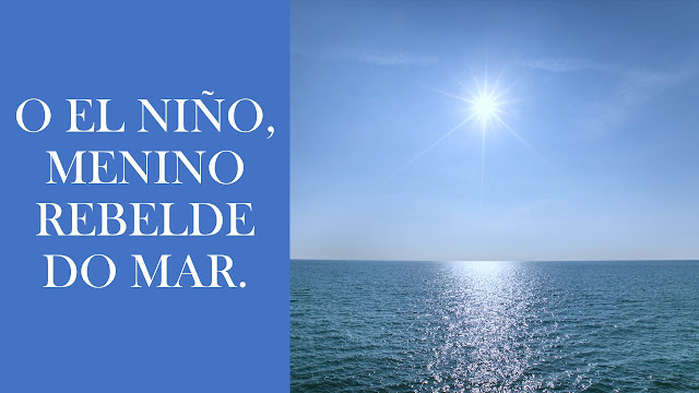 A imagem mostra o mar com água crstalina e o Sol radiante no Céu. No canto esquerdo da foto está inscrito: O El Niño, menino rebelde do Mar.