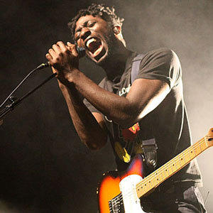 Bloc Party's Kele Okereke screaming out a song