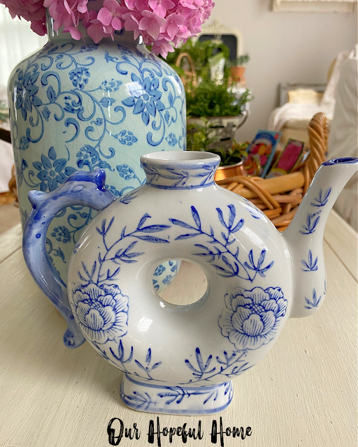 blue and white floral patterned porcelain donut teapot