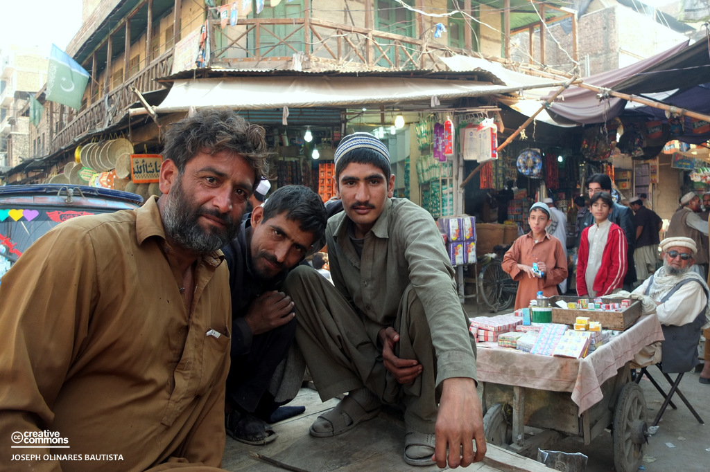A group of men sitting on a donkey-drawn cart pose for a photo in Peshawar, Pakistan / Photo by: Joseph Bautista