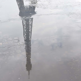 Eiffel Tower Reflected in Puddle by Jeanne Selep