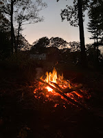 Campfire in the woods along the route of march.