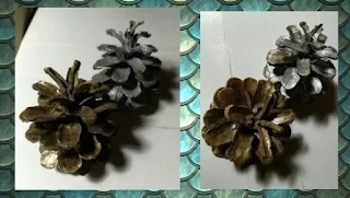 doua conuri de pin; unul vopsit cu argintiu si unul vopsit cu auriu