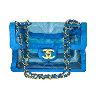 Vintage 1990's clear blue PVC Chanel bag with gold chain strap and gold CC logo front closure.