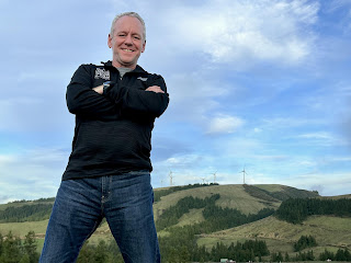 Rep Jeff Roy and what else but wind turbines in the background!