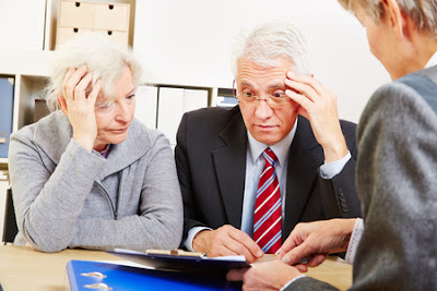 Anxious elderly senior couple worring about financial security at consultation