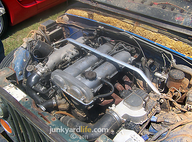 A 1990 Mazda Miata 16 Liter engine at home in the CJ's engine bay