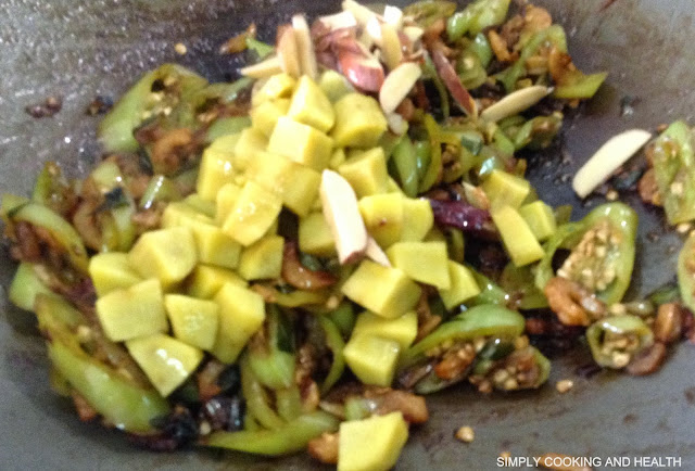 Adding boiled sweet potato and jack fruit seeds