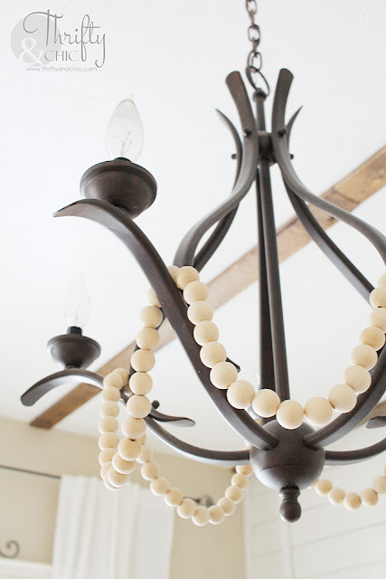 DIY Farmhouse chandelier. Change any chandelier into a farmhouse chandelier. How to makeover your chandelier. Farmhouse decor and decorating ideas. Dining room decor. Dining room chandelier.