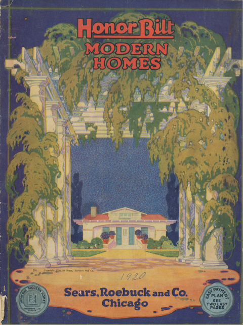 Front of 1920 Sears Honor Bilt Modern Homes catalog, blue background, green foliage on huge white columns, Sears Hollywood model inside the columns