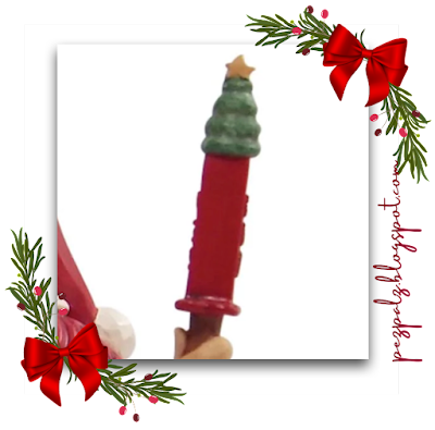 Jim Shore PEZ Santa holiday figurine with satchel full of PEZ close up 3
