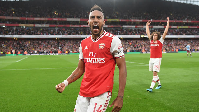 Arsenal 3-2 Aston Villa Arsenal's Pierre-Emerick Aubameyang celebrates after scoring the goal that settled this five-goal thriller