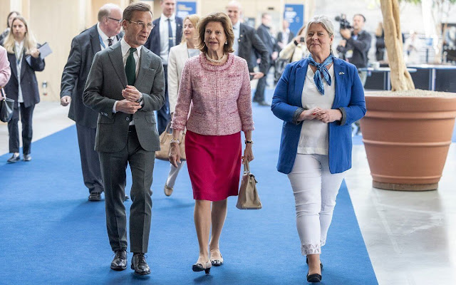 First Lady of Ukraine Olena Zelenska. Queen Silvia wore a pink tweed jacket by Chanel and red midi skirt. Chanel beige pumps