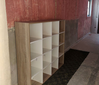 One of what will be six book shelves