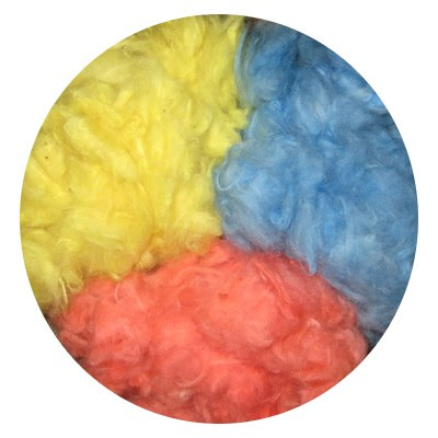Cotton lint dyed, dried, & fluffed for a photo.