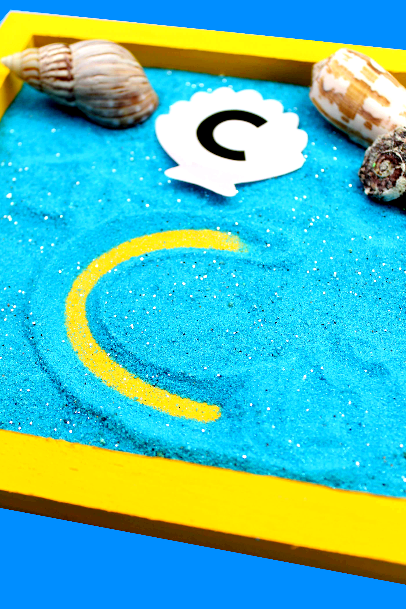 sand writing tray - alphabet activity for preschoolers