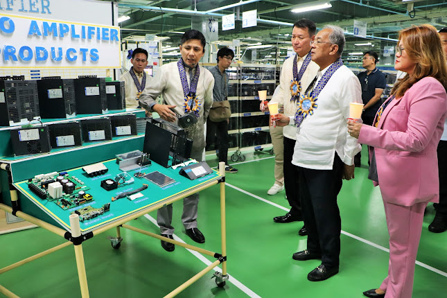 Subic Bay Metropolitan Authority (SBMA) Chairman and Administrator Eduardo Jose L. Aliño and Sanyo Denki President Hirokazu Takeuchi check on some of the products on display as they tour the new building of Sanyo Denki Philippines, Inc. at the at Subic Techno Park inside the Subic Bay Freeport zone on March 22, 2024. Also joining them is Ms. Karen Magno, head of the SBMA Business and Investment Department for Manufacturing and Maritime.