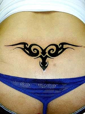 tribal tattoos for women on lower back. lower back tattoos with tribal