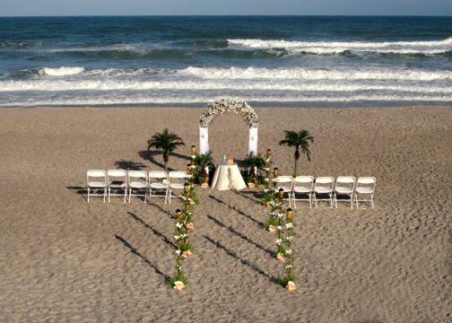 Destination on a beach somewhere come home and have a reception in the