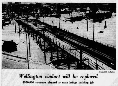 Rooftop winter photo from a newspaper clipping of the viaduct, with the caption Wellington viaduct will be replaced: $950,000 structure planned as main bridge building job.