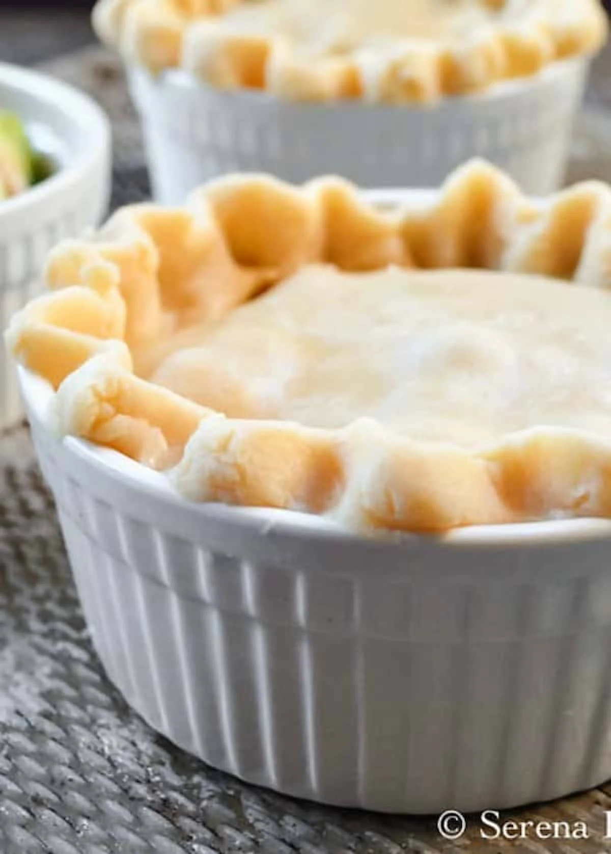 Unbaked Homemade Chicken Pot Pies on a cookie sheet.