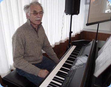 Claude Moffat played part of the arrival music on the Club's Yamaha Clavinovva CVP-509. Photo courtesy of Dennis Lyons.