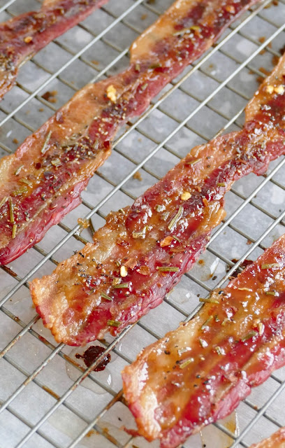 bacon on a wire rack over parchment paper.