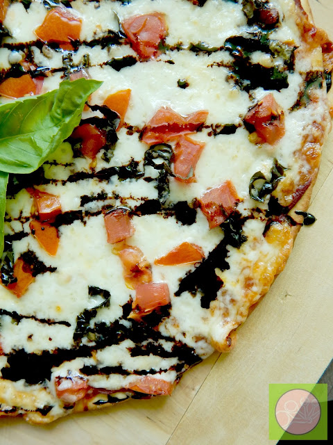 margarita pizza with balsamic drizzle (sweetandsavoryfood.com)