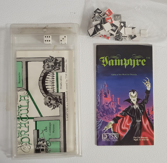 Vampyre minigame in clamshell, with dice, counters and map